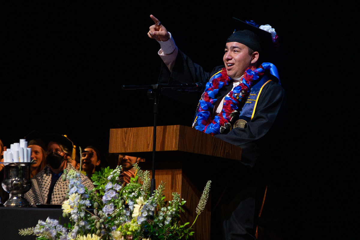 Graduating student Gilberto Martinez welcomes guests to the TDPS commencement ceremony